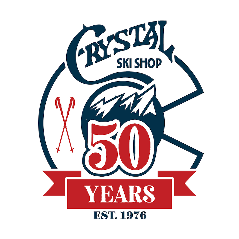"Crystal Ski Shop" 50 year anniversary logo with ski poles and flatirons mountains